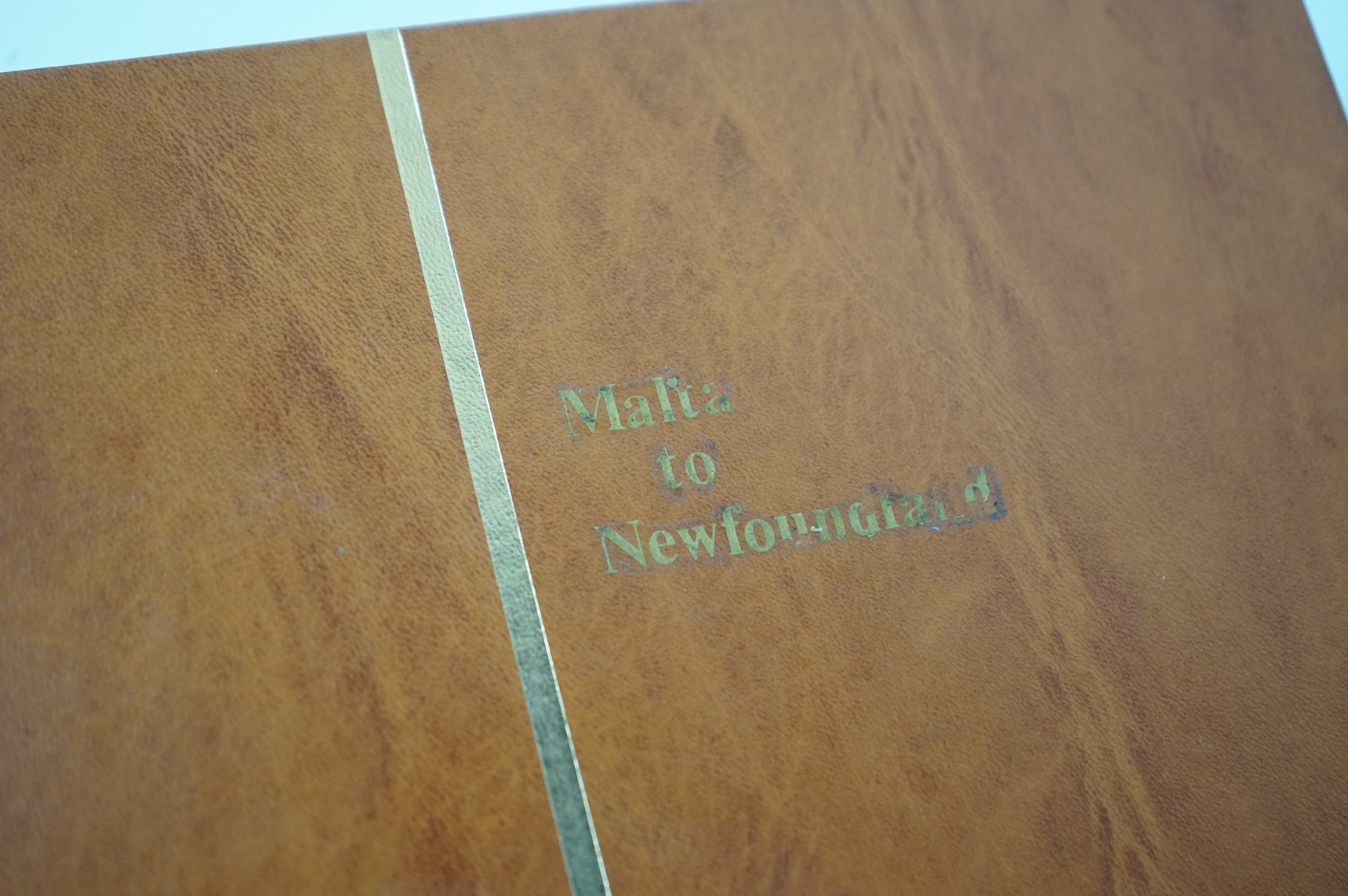 Four albums of stamps: Newfoundland, Jamaica etc (4). Condition - mostly stamp marked